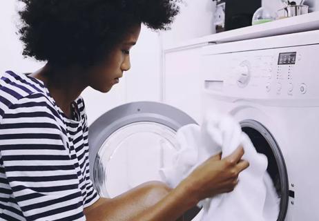 allergic woman washing sheets