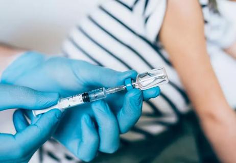 preparing flu shot for child in doctor's office