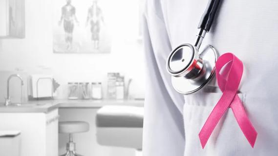 Updated Breast Cancer Guidelines, patient room with stethoscope and pink ribbon