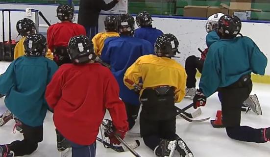 Kids playing hockey