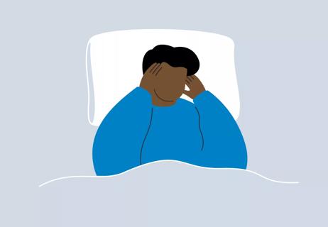 An illustration of a person laying in bed and holding their head in pain