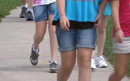 Kids walking on sidewalk