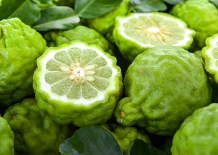Whole and sliced open bergamot fruits