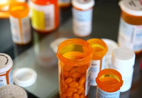 multiple pill bottles on a table