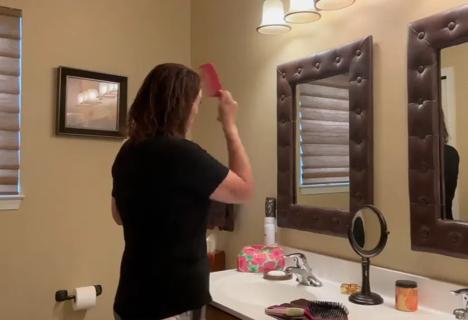 Woman brushing hair