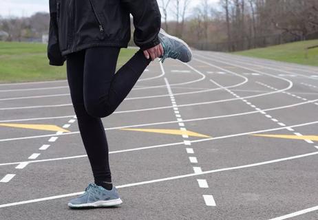 Stretching at Track Before a Run