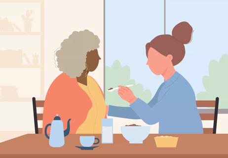 An illustration of a person helping another person eat with a spoon