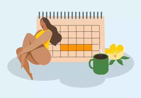 Woman relaxing by a menstrual calendar.