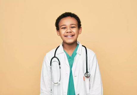 Young boy dressed as physician