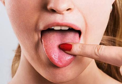 woman pointing to salty tongue