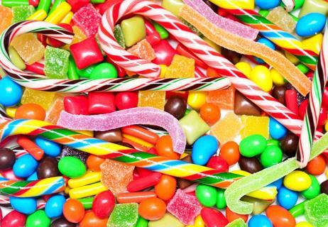 A closeup of a mix of different kinds of candy, all thrown together.
