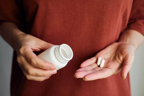 Woman taking calcium supplements.