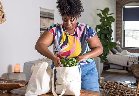 Person unpacking groceries at home