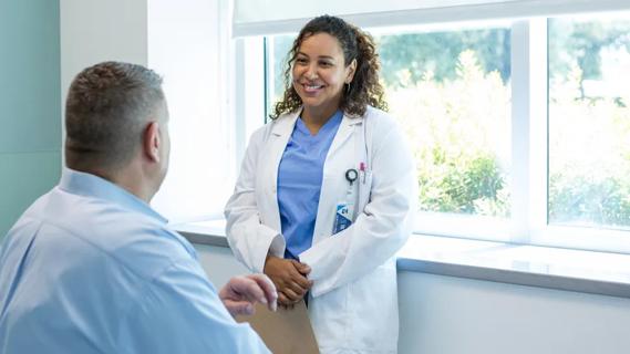 Doctor with overweight older adult