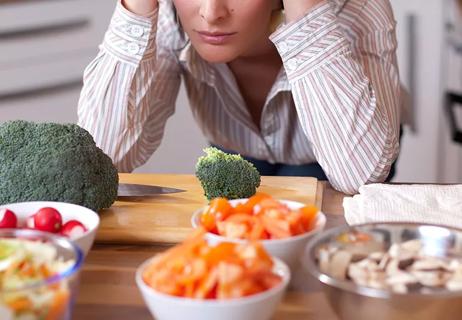 Person looking at table of food.