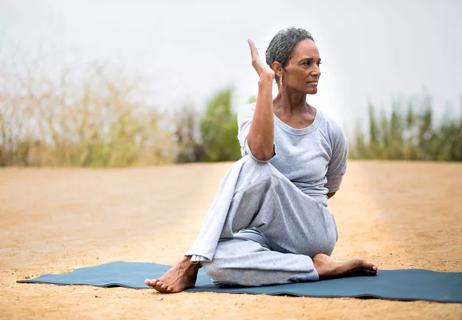 Elderly woman practicing yoga