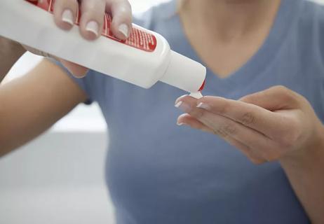 Person applying sunscreen.