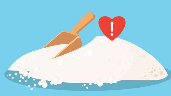Pile of salt with wooden scoop, with exclamation mark inside shape of a heart