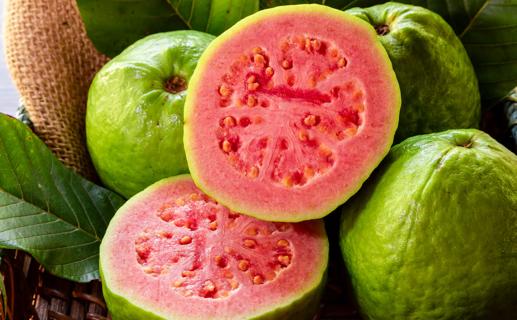 Whole and sliced open guava fruit