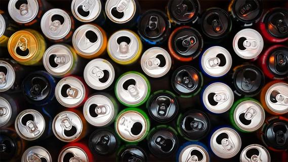 overhead photograph of open and empty energy drinks
