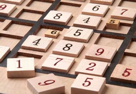 A wooden sudoku board.