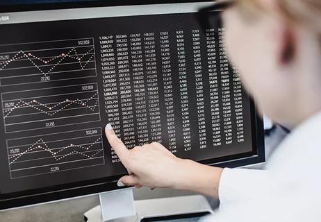 Scientist Pointing at Computer Screen