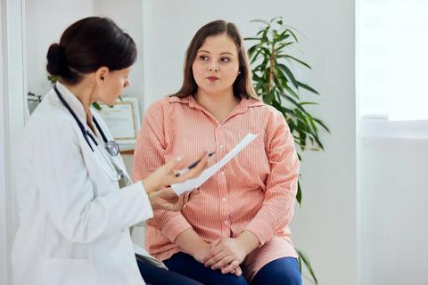 female patient in consultation with doctor