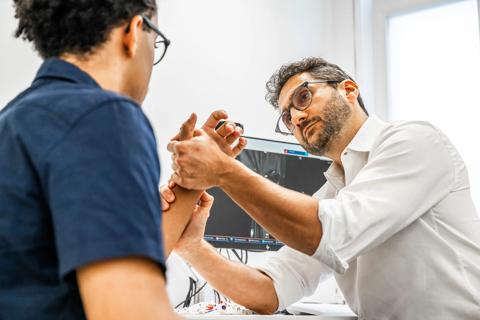 Hand surgeon with patient
