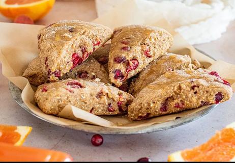 A plate of triangular-shaped whole wheat cranberry scones