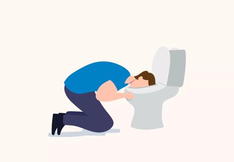 person kneeling with their head in a toilet