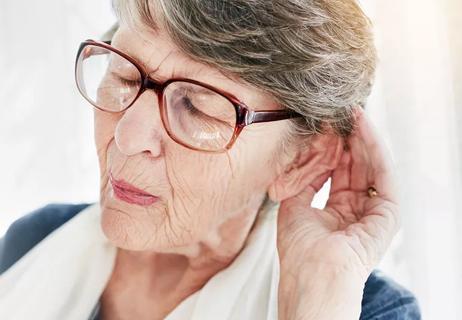 Elderly woman suffers from hearing loss