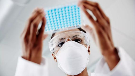 Woman examining laboratory samples