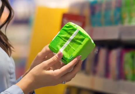 woman shopping finding scented tampons or pads