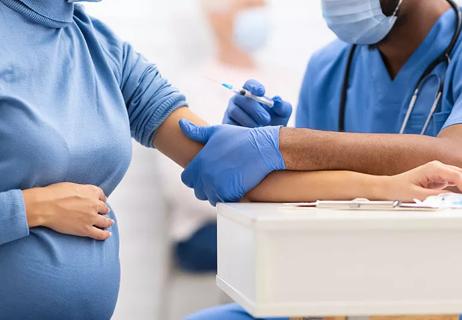 pregnant woman getting the covid vaccine