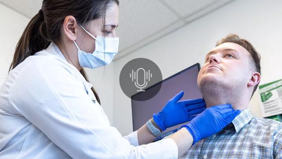 Physician checking patients neck