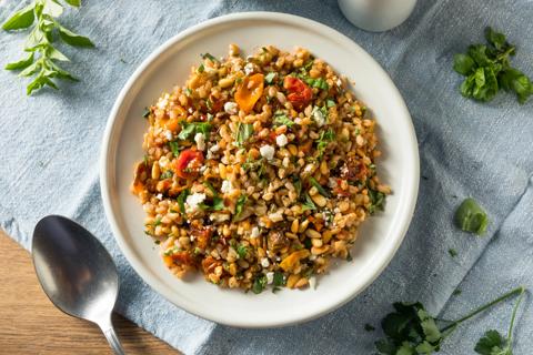 Plate of farro salad, with large serving spoon