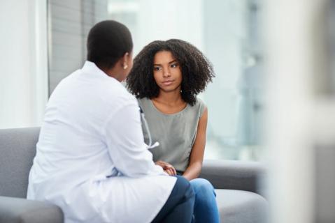 Physician speaking with patient