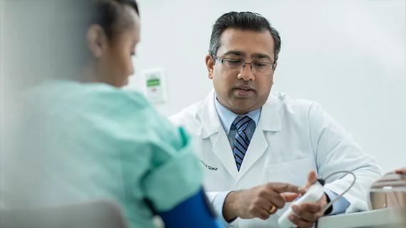 Dr. Thomas with a patient