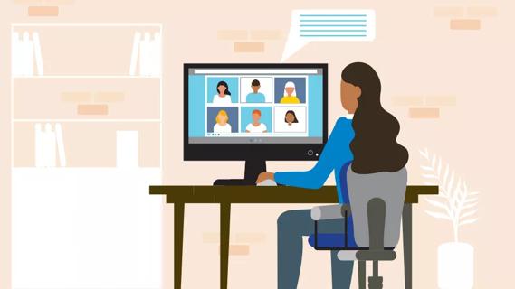 Female sitting at desk with computer screen with video meeting with multiple people