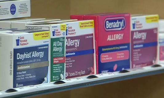 Allergy medication on a shelf.