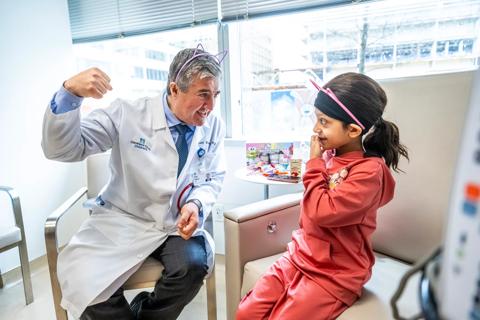 Dr. Hanna gives patient a clinical exam
