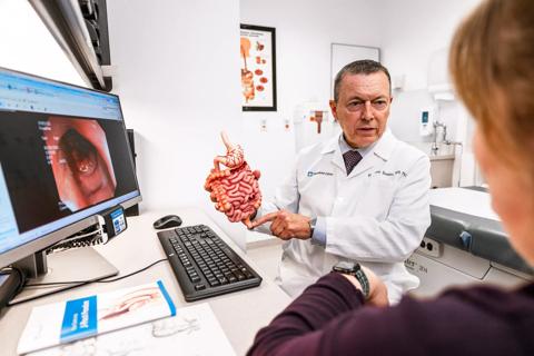 Hermann Kessler, MD, with patient