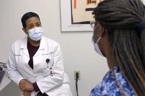 Patient talking to doctor