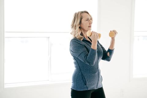 Older person lifting light weights