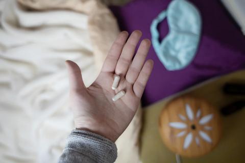 Palm with two capsules on it