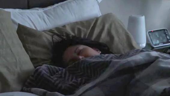 Person sleeping in bed.