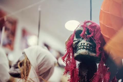 How Scary Is Too Scary for Your Kids This Halloween? | Skulls and spooky atmosphere in a store before Halloween