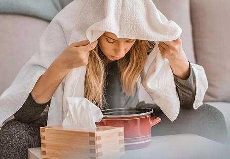 woman breathing steam to help lungs function