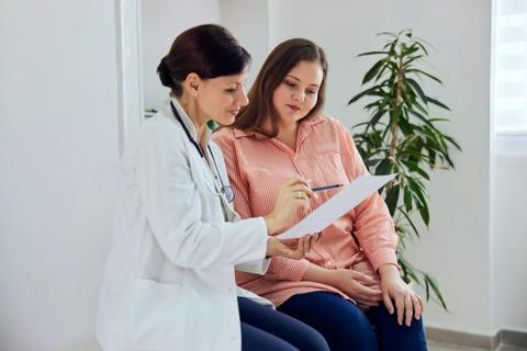 Healthcare provider going over information with a patient