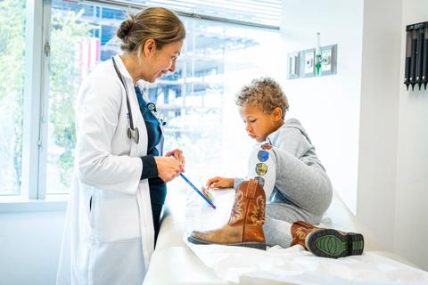 Pediatrician with child